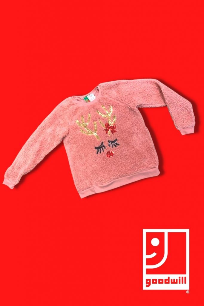 pink sweater on a red background