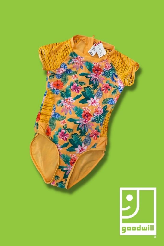 a yellow bathing suit on a green background